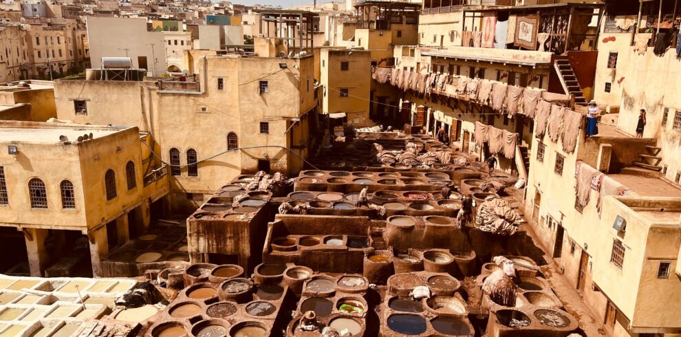 Aerial view of ancient leather tanneries in Fez, showcasing traditional Moroccan craftsmanship.